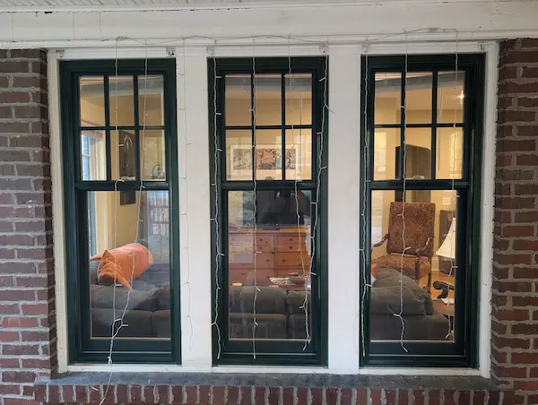 Andersen Woodwright double-hung replacement windows with forest green exteriors installed on a 1918 home in Mac-Groveland, St. Paul, MN