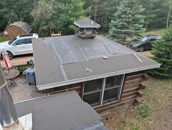 Low-slope roof replacement with new roofing underlayment